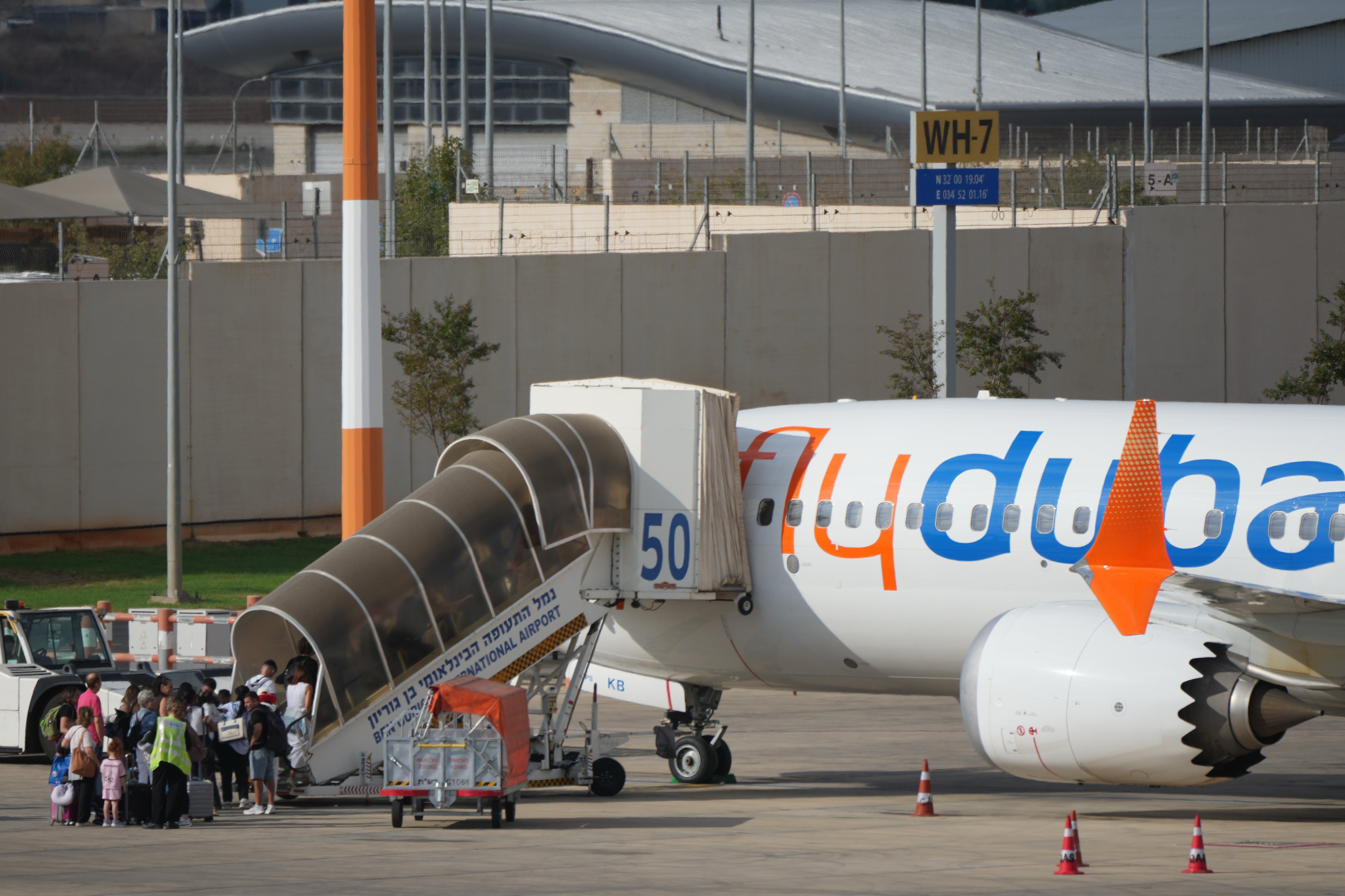 Passengers embark on a FlyDubai aircraft at Ben Gurion International Airport, near Tel Aviv
