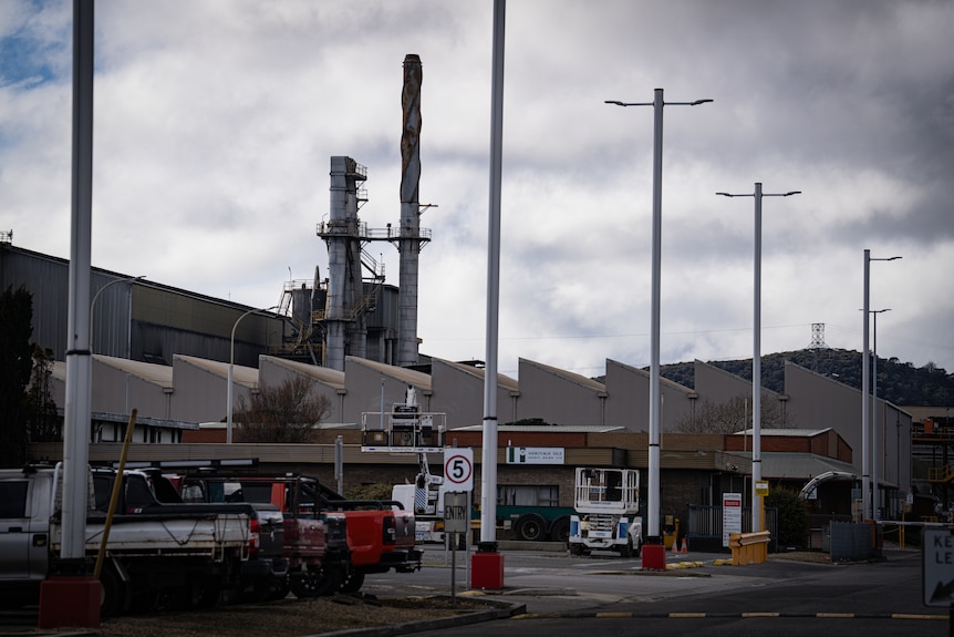 An industrial site with a furnace in the background.