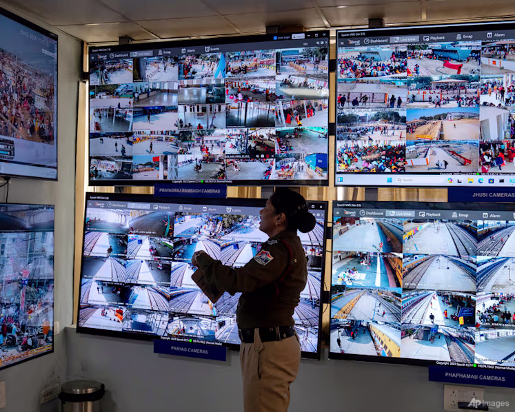 An Indian policewoman looks at CCTV footage at Prayagraj Junction station during the Mahakumbh festival, in Prayagraj, India, Tuesday, Feb. 18, 2025. (Photo: AP/Rajesh Kumar Singh)