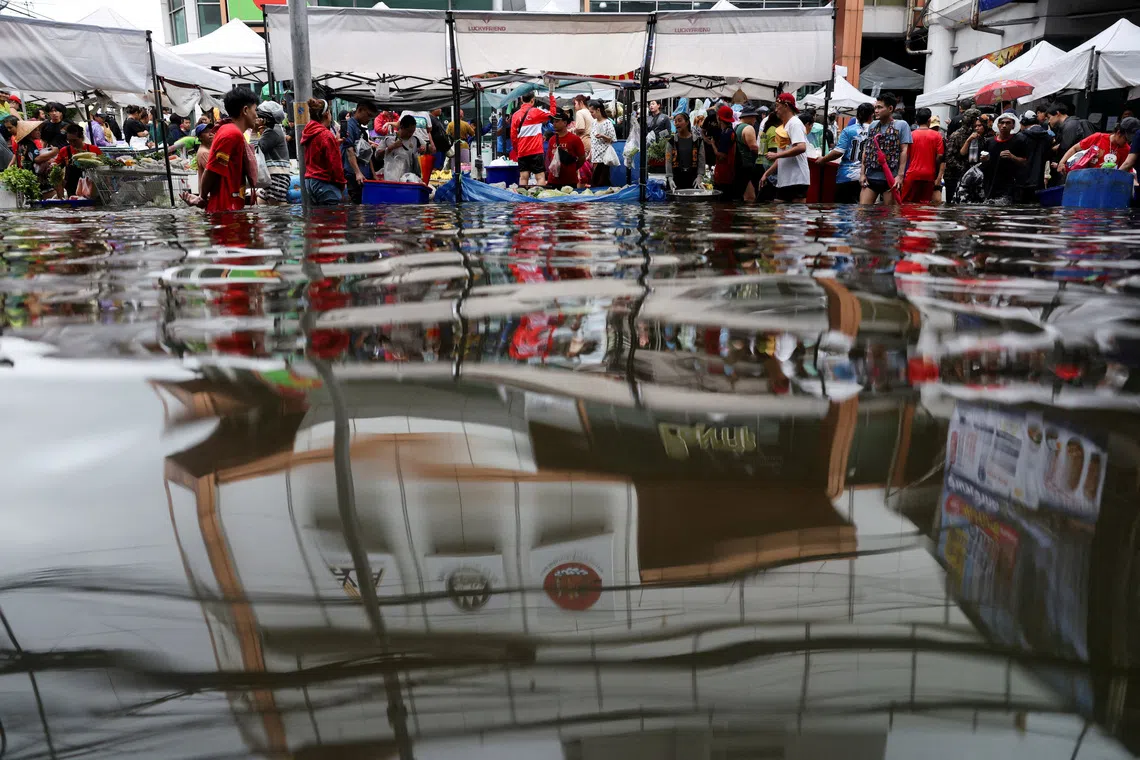 Thousands huddle in Bangkok shelters as economic damage from Thailand floods rises