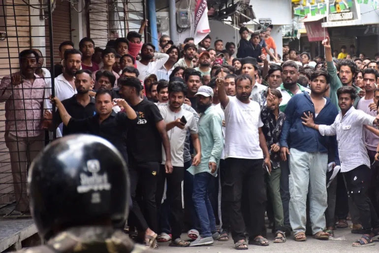 Protesters gesture towards police officers during a demonstration near the Shahi Masjid in Ujjain, Madhya Pradesh, India, September 28, 2026 [Reuters]