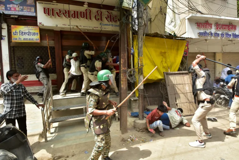 Police officers attack protesters near the Shahi Masjid in Ujjain, September 28, 2026 [Reuters]