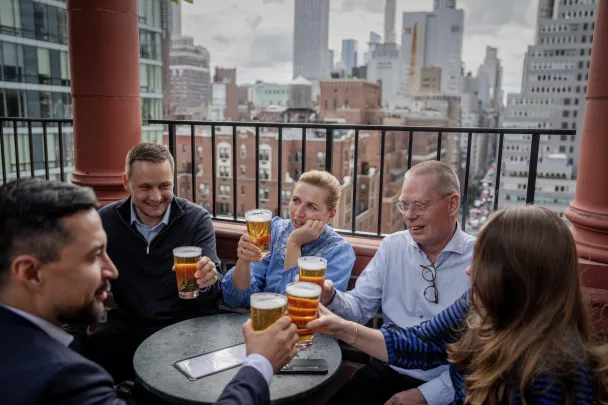 Denmark's Prime Minister Mette Frederiksen, Greenland's Premier Jens-Frederik Nielsen, and Greenland's Minister for Foreign Affairs Mute B. Egede have a beer with delegations at a bar in Manhattan, after the agreement has been signed in New York, US, September 22, 2026. (Reuters)