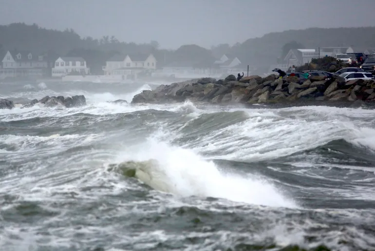 People watch the ocean as a nor'easter storm hits Rye, New Hampshire, US on Sunday, September 27, 2026 [Caleb Jones/AP Photo]