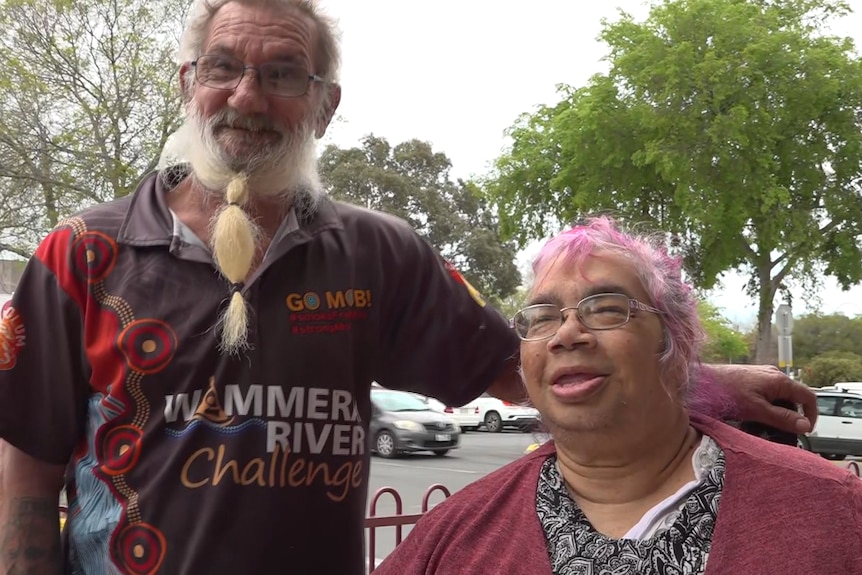 Couple Andrew and Annie Nikkelson pictured on a street in Horsham