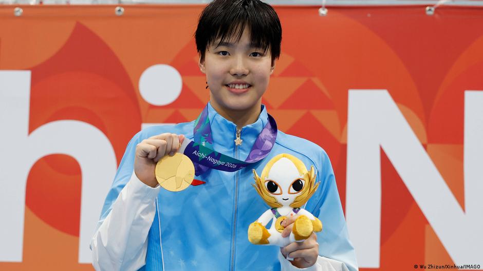 China's swim star, Yu Zidi, 13 wins three golds . But there can be a price to pay for child athletes.