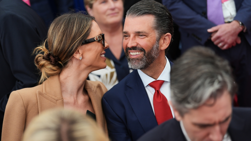 Donald Trump Jr, center, speaks with his wife Bettina, left, as they wait for US President Donald Trump to deliver remarks to US embassy staff at Deerfield Residence in Dublin. (AP FILE)