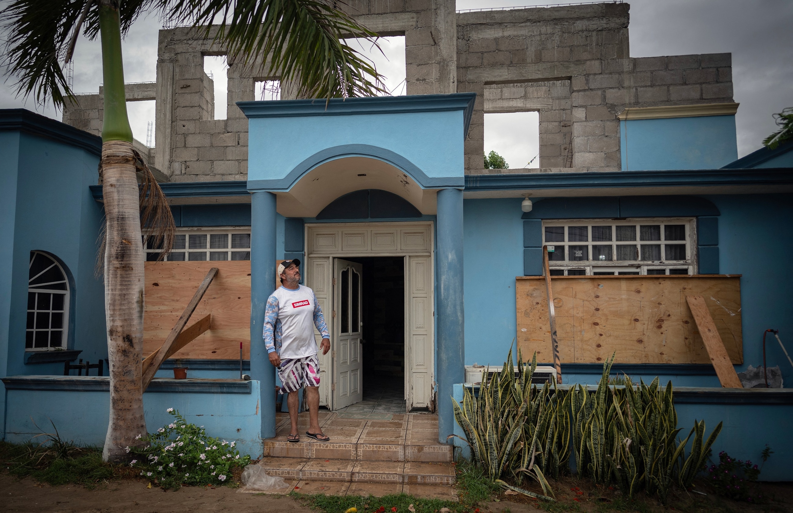 Juan Manuel Sarabia stands outside his boarded-up house in Puerto San Carlos, Baja California Sur, Mexico, ahead of the arrival of Hurricane Polo, which made landfall, September 28, 2026, near Las Barrancas.Carl De Souza/AFP via Getty Images