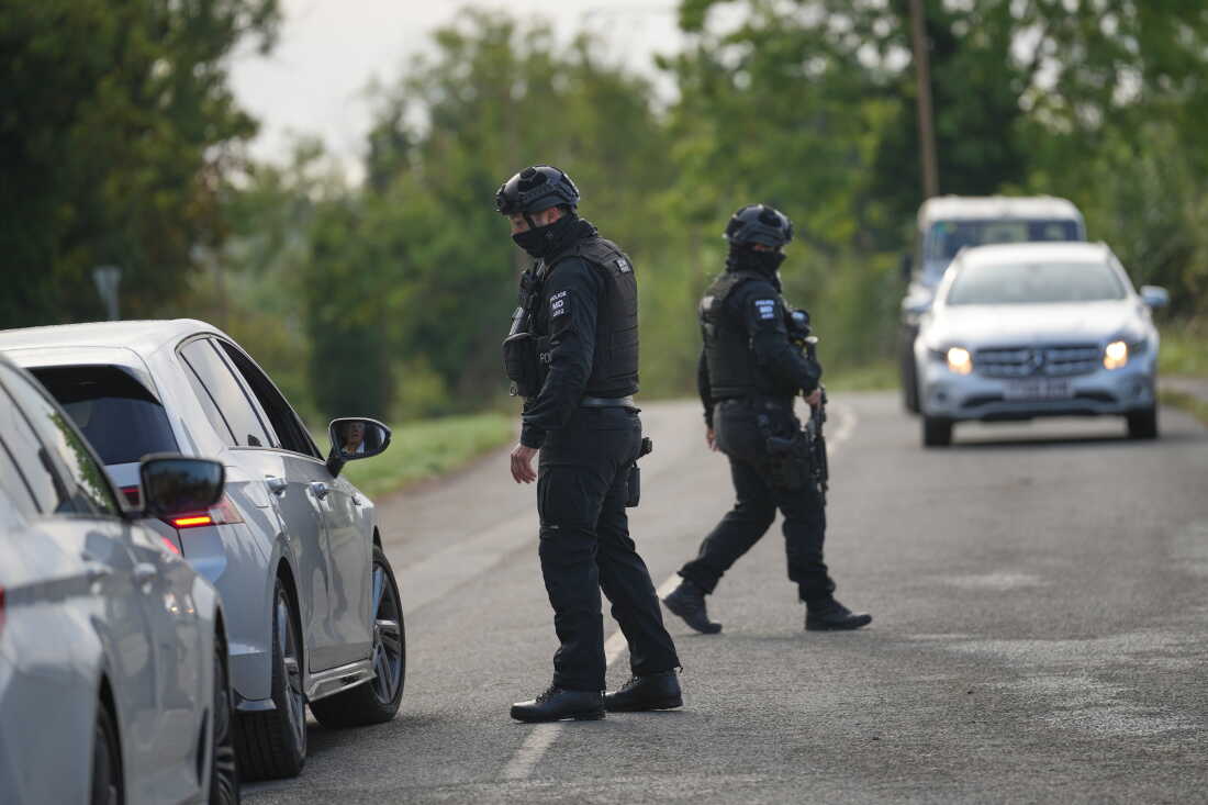 Police guard a road leading to RAF Fairford, in Fairford, England, Monday, Sept. 28, 2026.