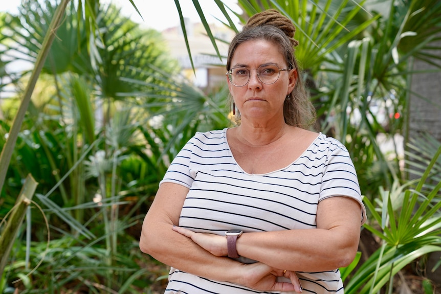 woman with dreadlock and glasses looking crossed