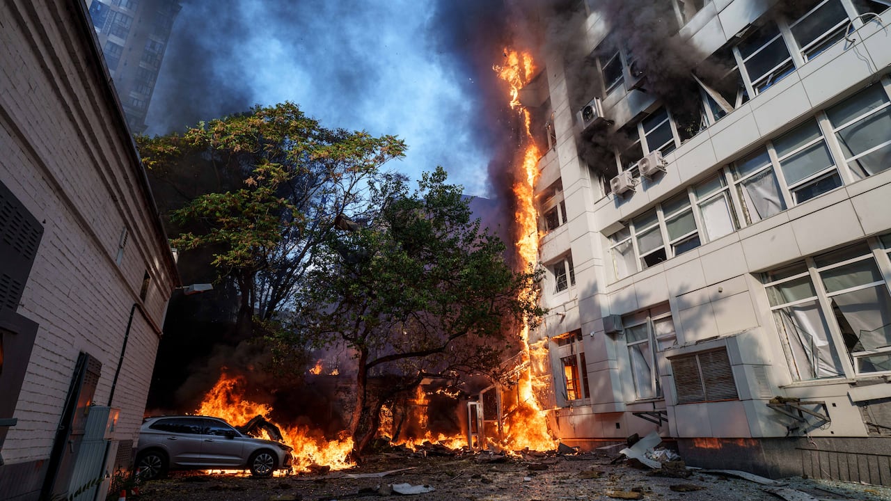 Flames are seen at site of burning hospital in Kyiv, after a Russian drone strike.