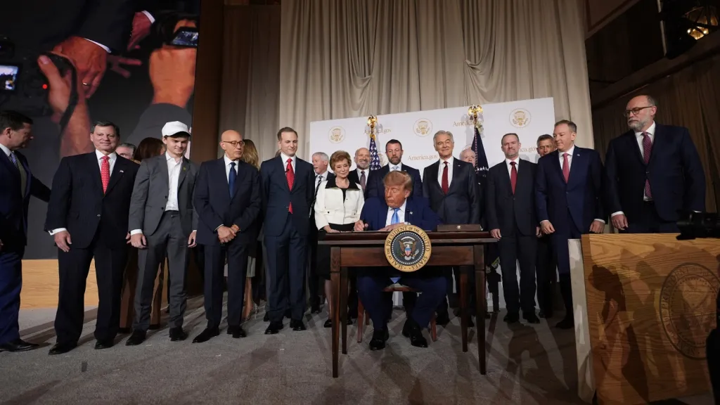 President Donald Trump surrounded by Cabinet members and others during a signing ceremony, at the Andrew W. Mellon Auditorium, Tuesday, Sept. 29, 2026, in Washington