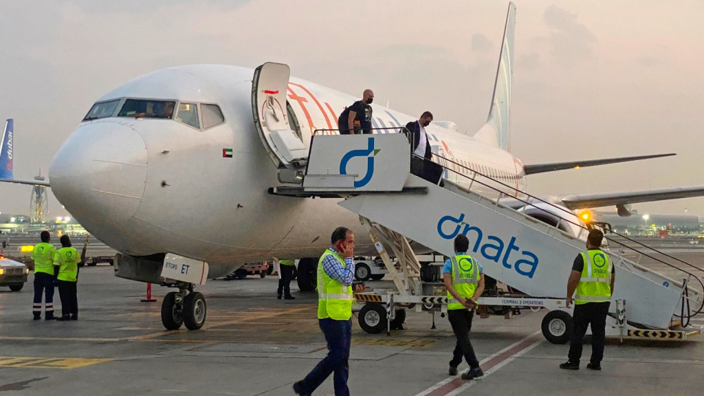 Israeli tourists leave a FlyDubai plane which departed from Ben-Gurion International Airport in Tel Aviv and landed in Dubai, United Arab Emirates.(AP FILE)