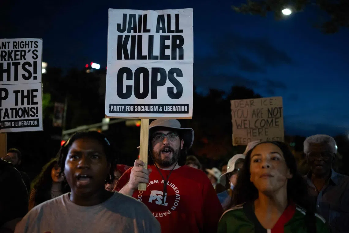 People protest outside the Texas State Capitol in Austin, Texas, on September 21, 2026, a day after a Venezuelan national was shot and wounded during a US Immigration and Customs Enforcement (ICE) operation.