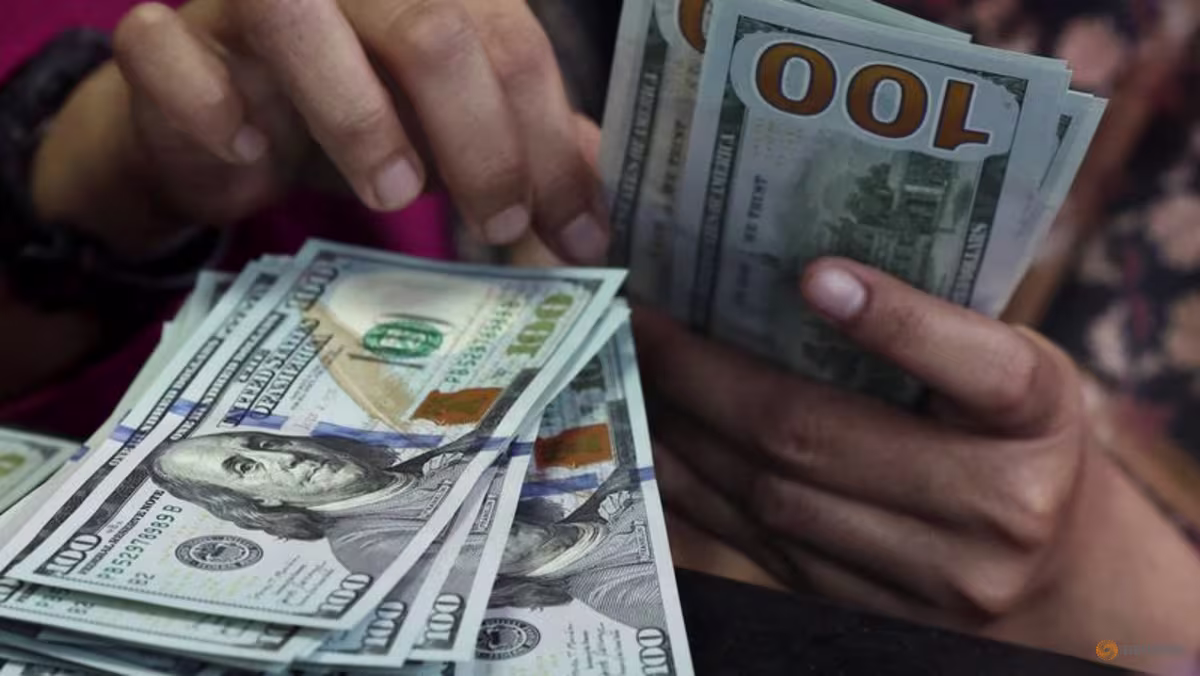 Dollar holds near two-month peak as yields rise, Fed data looms