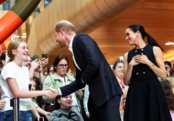 Prince Harry, the Duke of Sussex, greets a girl as he visits the Royal Children's Hospital along with Meghan, Duchess of Sussex, in Melbourne, Australia, April 14, 2026. (REUTERS)